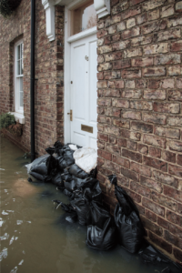 Flooded house with sandbags.