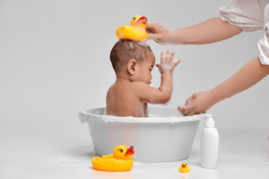 Baby bathing in tub.