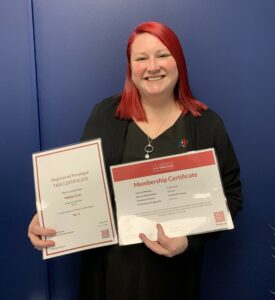Nadine Carr with certificates